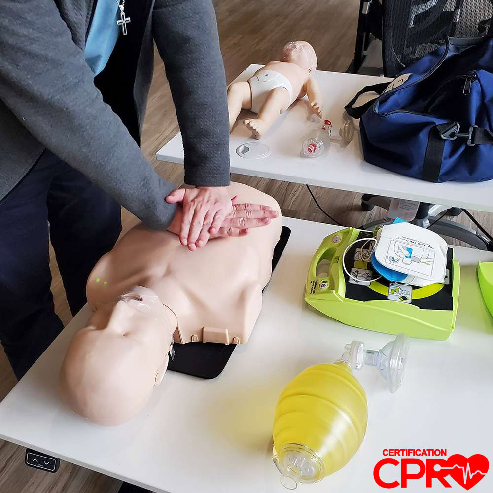 CPR training on mannequin for certification in Nashville.